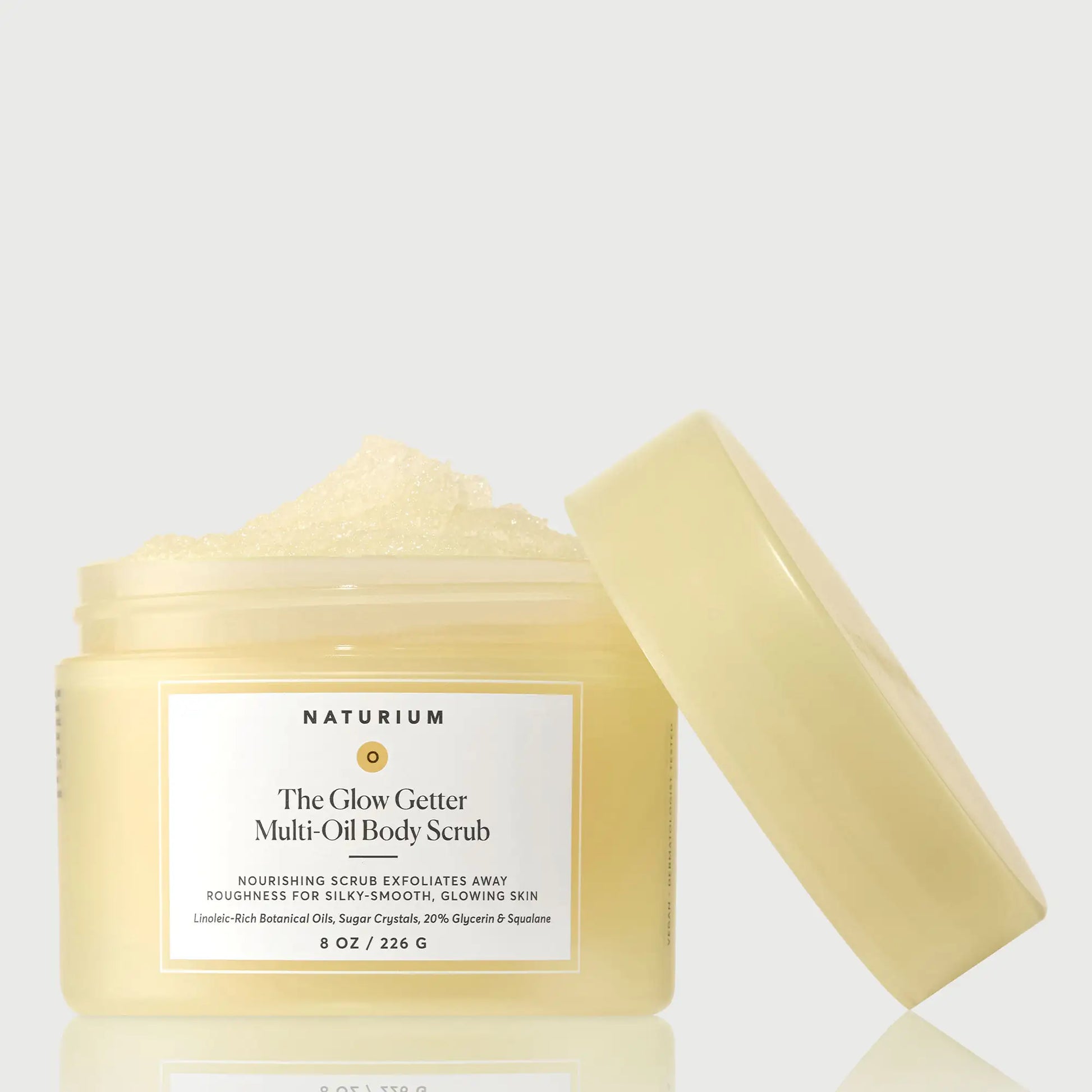 the-glow-getter-multi-oil-body-scrub-i2 NATR-40028-GlowGetter-Multi-Oil-Body-Scrub-Front-CapOff-bonebkgd.webp